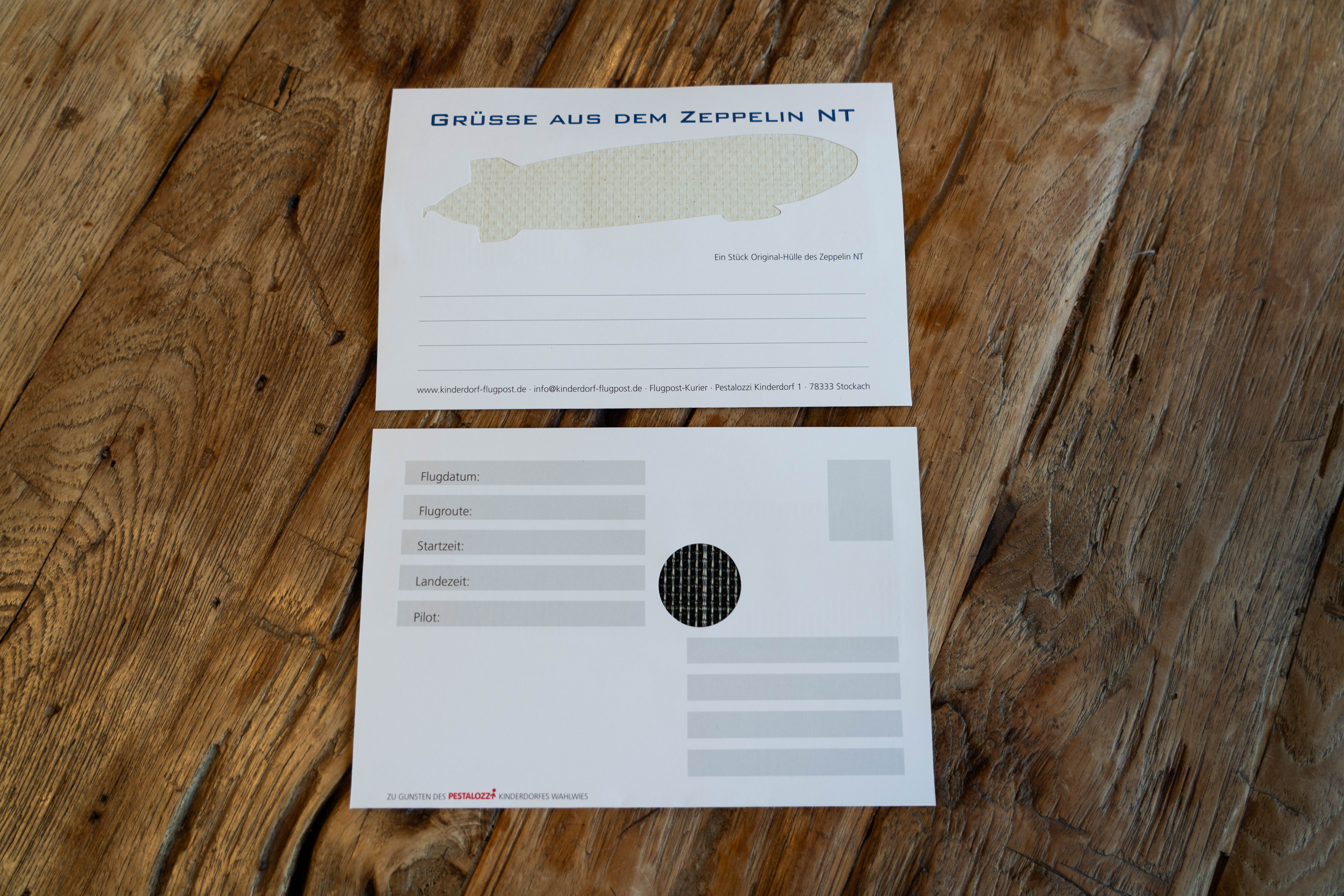 Postkarte mit originaler Zeppelinhülle limitiert