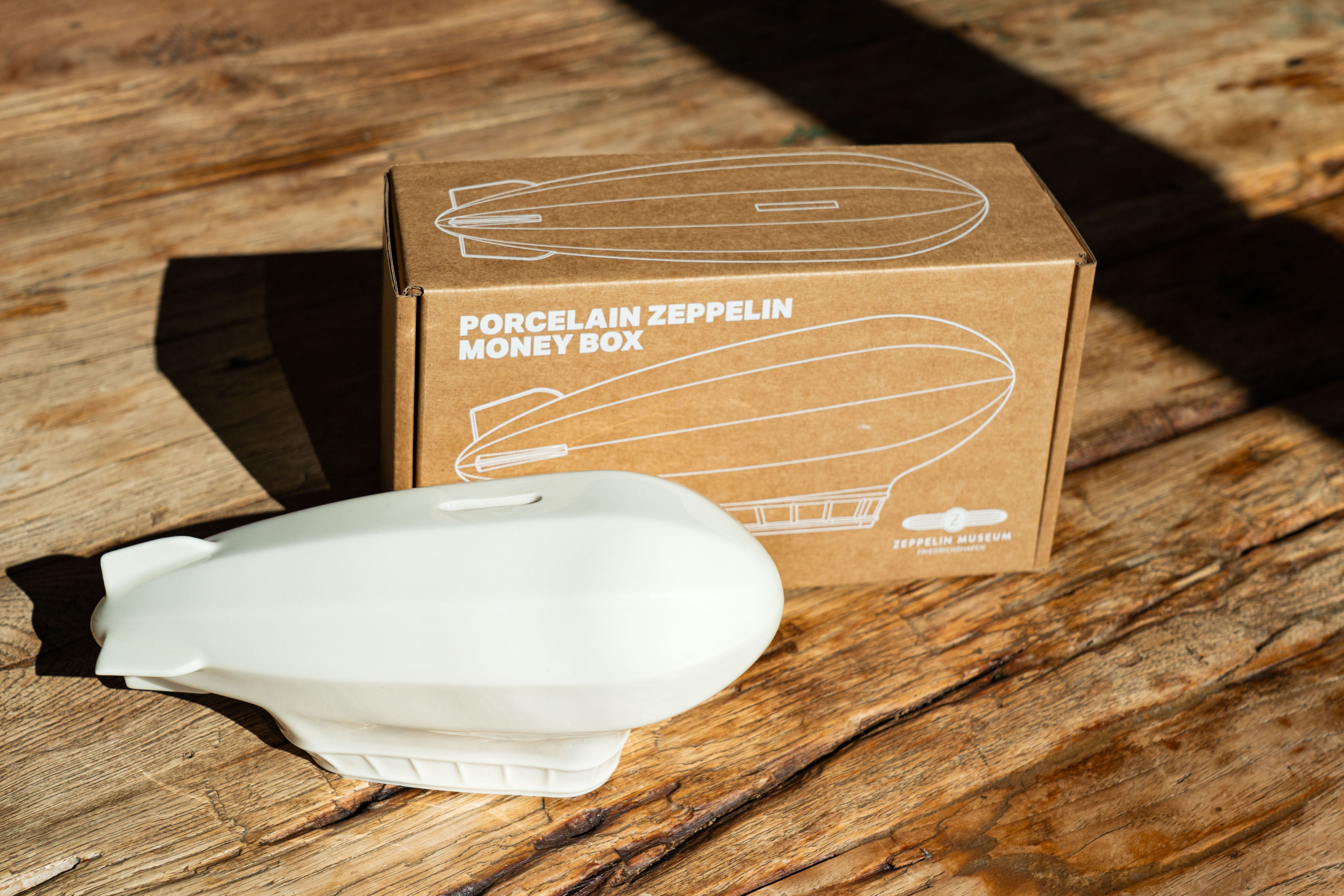 Zeppelin Sparschwein aus Porzellan
